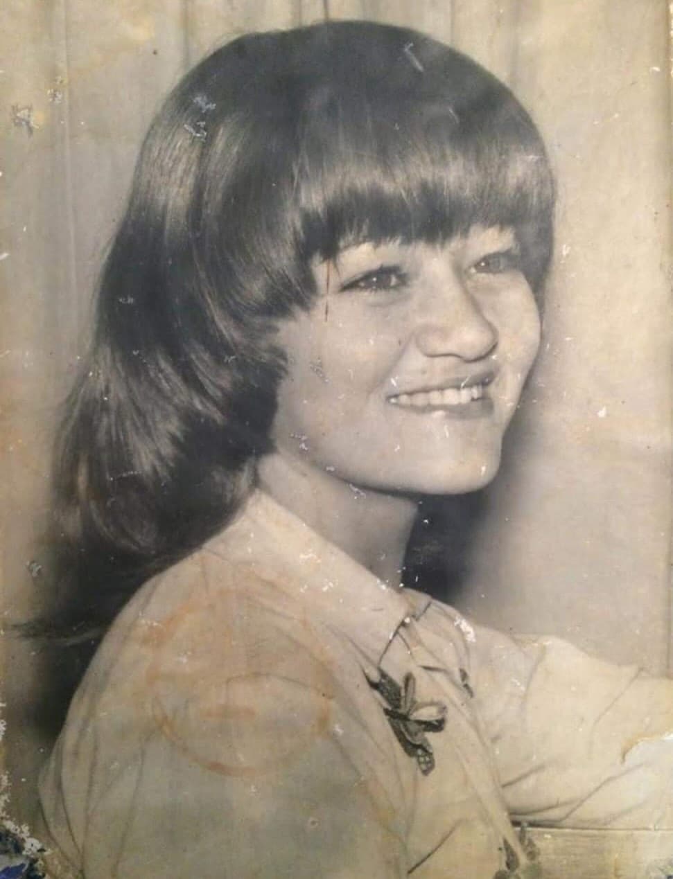 Faded black and white photo of young woman